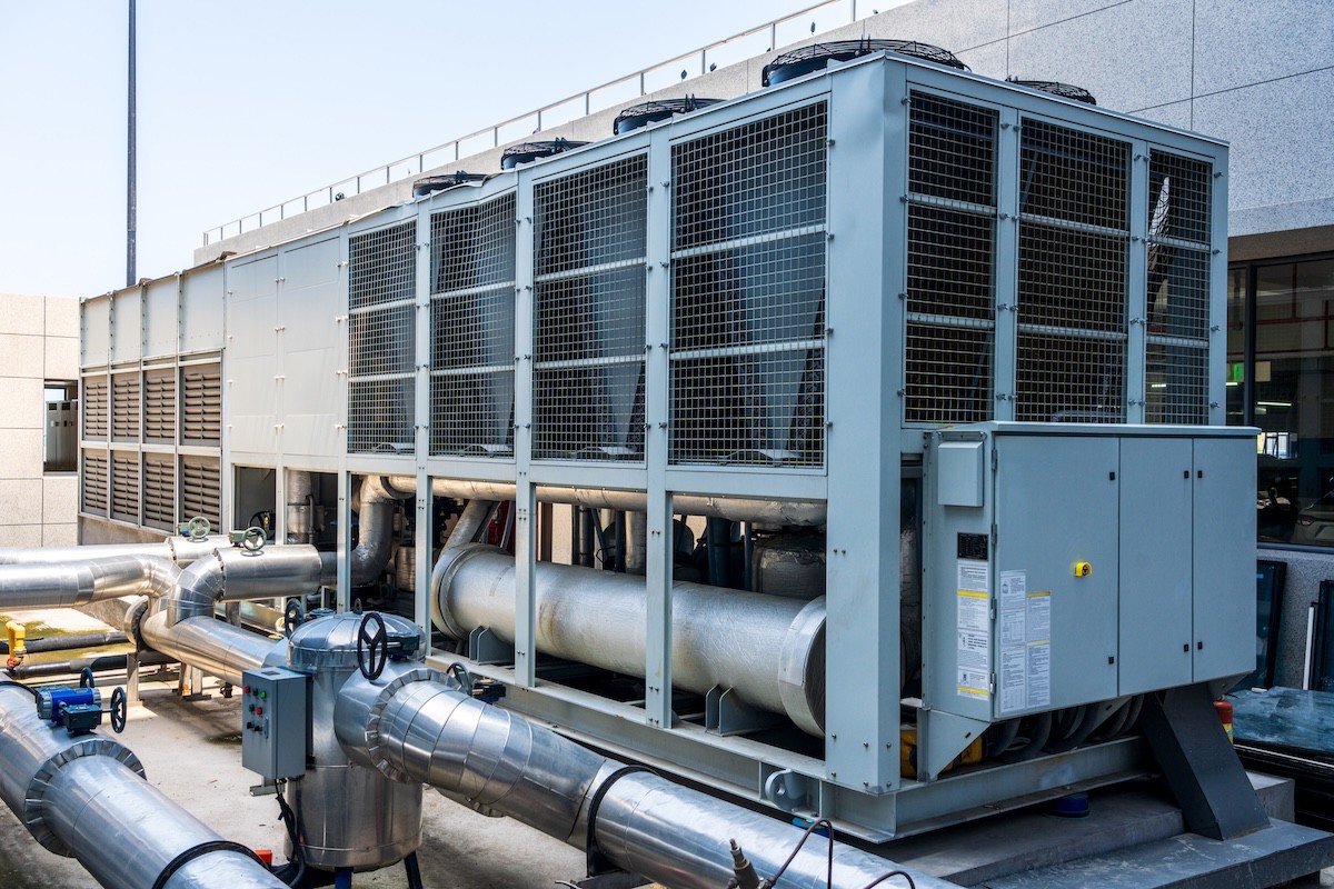Air-cooled commercial chiller installed outdoors on a rooftop pad