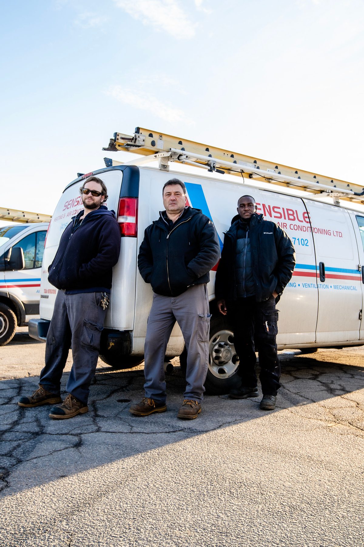 The Sensible service team in front of their vans
